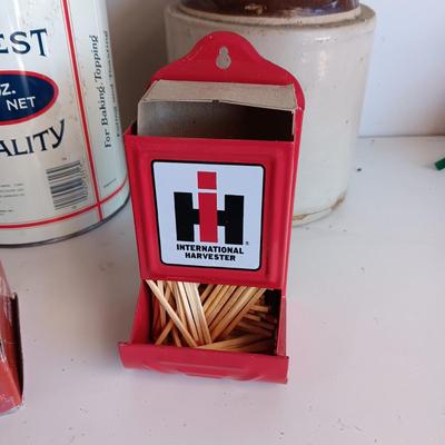 CLAY JUG, INTERNATIONAL HARVESTER MATCH HOLDER AND AN OLD TIN