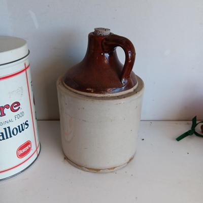 CLAY JUG, INTERNATIONAL HARVESTER MATCH HOLDER AND AN OLD TIN