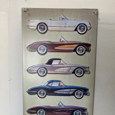 2 TIN SIGNS WITH RAISED ILLUSTRATIONS
