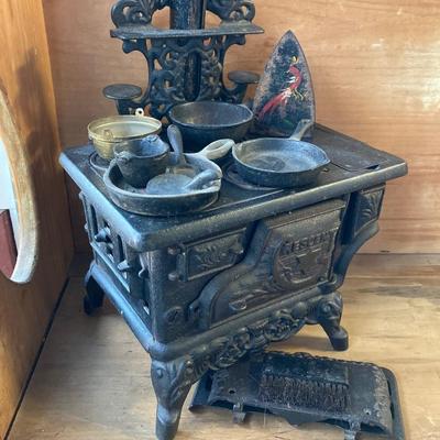 LOT 66: Vintage Miniature Crescent Cast Iron Stove with Cookware