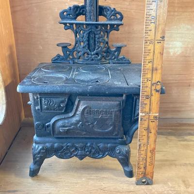 LOT 66: Vintage Miniature Crescent Cast Iron Stove with Cookware