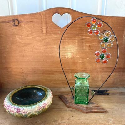 LOT 69: Children's Wooden Bench / Seat with Pottery, Watering Cans, MCM Wood Based Green Glass Vase with Stained Glass Flowers,...