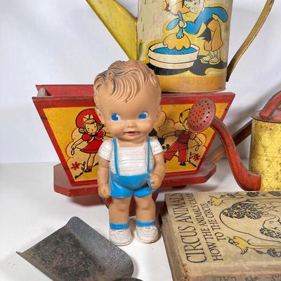LOT 75: Vintage Children's Toys - Watering Cans, Doll (The Sun Rubber Co / Ruth E Newton), Wooden Cart, Books and More