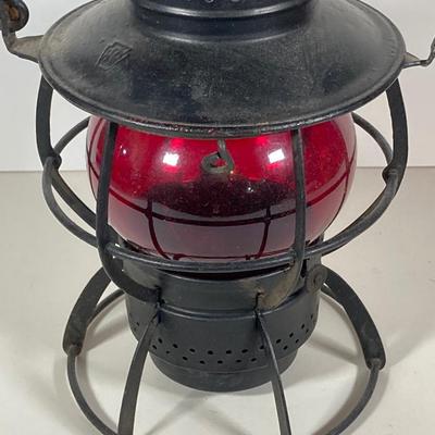 LOT 81: Vintage Black and Red Dressel Oil Lantern and Two Winged Wheel (Yellow and Red)