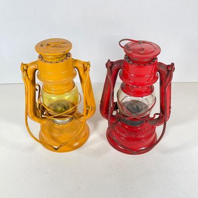 LOT 81: Vintage Black and Red Dressel Oil Lantern and Two Winged Wheel (Yellow and Red)