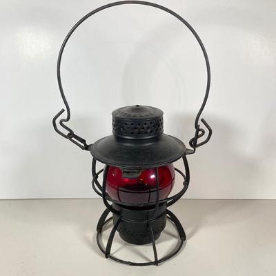 LOT 81: Vintage Black and Red Dressel Oil Lantern and Two Winged Wheel (Yellow and Red)