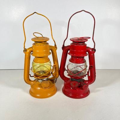 LOT 81: Vintage Black and Red Dressel Oil Lantern and Two Winged Wheel (Yellow and Red)
