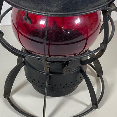 LOT 81: Vintage Black and Red Dressel Oil Lantern and Two Winged Wheel (Yellow and Red)