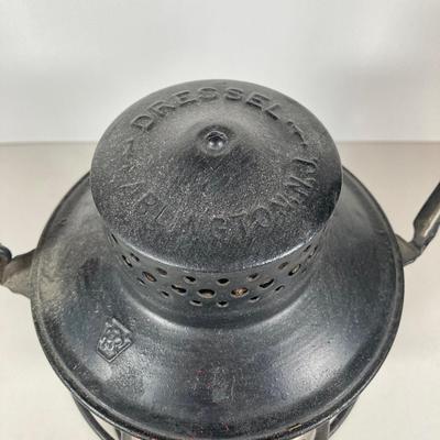 LOT 81: Vintage Black and Red Dressel Oil Lantern and Two Winged Wheel (Yellow and Red)