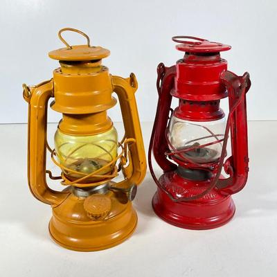 LOT 81: Vintage Black and Red Dressel Oil Lantern and Two Winged Wheel (Yellow and Red)