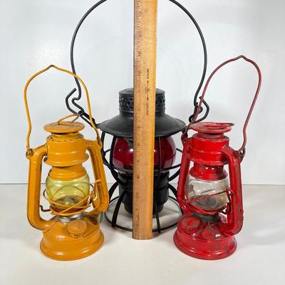 LOT 81: Vintage Black and Red Dressel Oil Lantern and Two Winged Wheel (Yellow and Red)