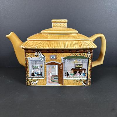 LOT 82: Tea-Time: McCormick Tea Baltimore, Md Teapot, Walkers of London Teapot & Mugs, Thomas Kinkade Mug, Norman Rockwell Mugs Set...
