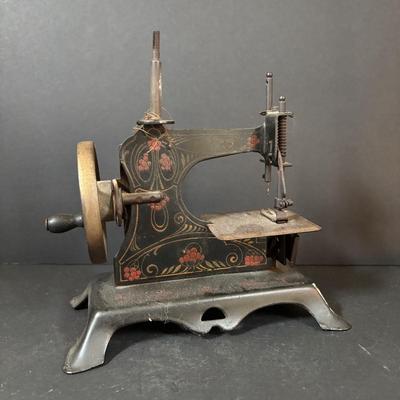 LOT 88: Antique Toy Sewing Machine Made in Germany, Sewing Notions & Button Shelf Sitter Doll