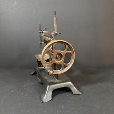 LOT 88: Antique Toy Sewing Machine Made in Germany, Sewing Notions & Button Shelf Sitter Doll