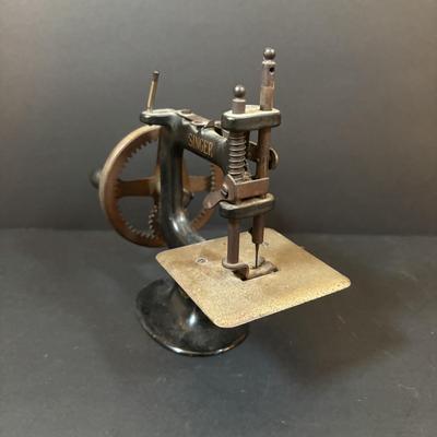 LOT 90: Antique Singer Childs Toy Sewing Machine & More