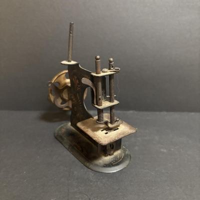 LOT 94: Made in Germany Hand Crank Toy Sewing Machine & Miniature China Dog Pin Cushion