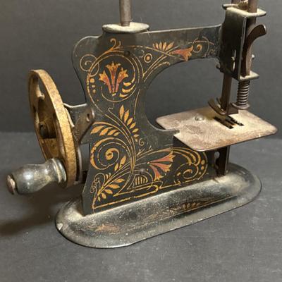 LOT 94: Made in Germany Hand Crank Toy Sewing Machine & Miniature China Dog Pin Cushion