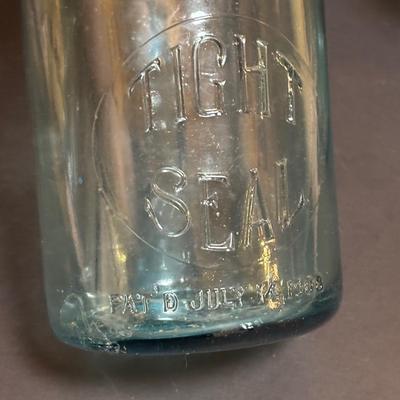 LOT 98: Vintage Canning Jars & Valley Dairy Milk Bottle, Pocket Balance Hanging Scale made in Germany, Iron Wall Match Holder &...