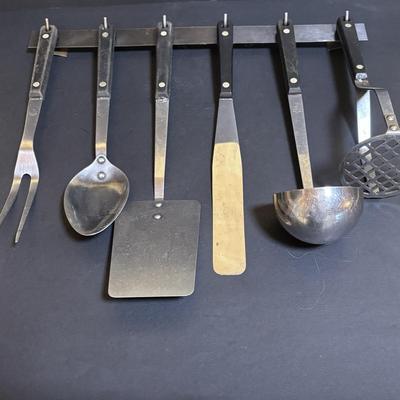 LOT 99: Unmarked Cast Iron Skillet, Zwilling Steak Knife Set, Trivets & Flint Stainless Steel Hanging Kitchen Utensil Set
