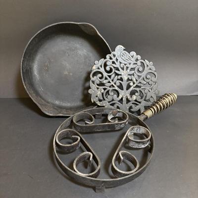 LOT 99: Unmarked Cast Iron Skillet, Zwilling Steak Knife Set, Trivets & Flint Stainless Steel Hanging Kitchen Utensil Set