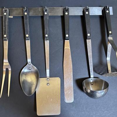 LOT 99: Unmarked Cast Iron Skillet, Zwilling Steak Knife Set, Trivets & Flint Stainless Steel Hanging Kitchen Utensil Set