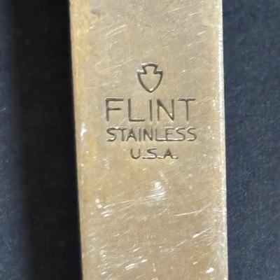 LOT 99: Unmarked Cast Iron Skillet, Zwilling Steak Knife Set, Trivets & Flint Stainless Steel Hanging Kitchen Utensil Set