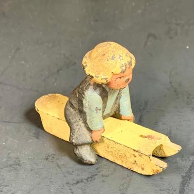 LOT 112: Collection of Cast Iron Amish Figurines and Salt and Pepper Shakers, and Vintage Pencil Sharpeners