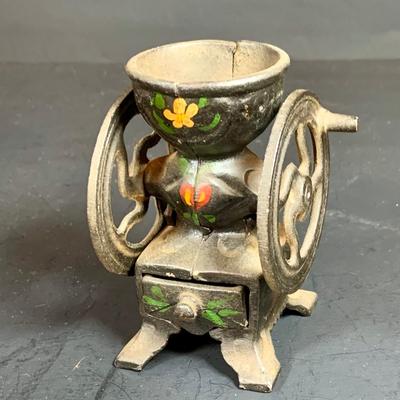 LOT 112: Collection of Cast Iron Amish Figurines and Salt and Pepper Shakers, and Vintage Pencil Sharpeners