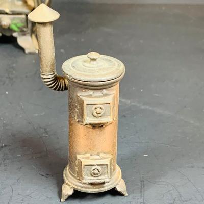 LOT 112: Collection of Cast Iron Amish Figurines and Salt and Pepper Shakers, and Vintage Pencil Sharpeners