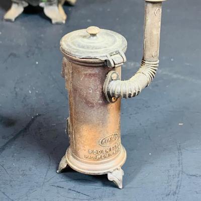 LOT 112: Collection of Cast Iron Amish Figurines and Salt and Pepper Shakers, and Vintage Pencil Sharpeners