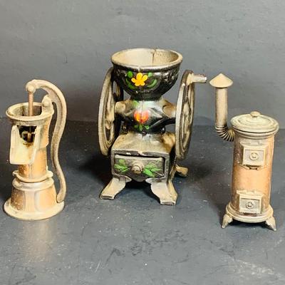 LOT 112: Collection of Cast Iron Amish Figurines and Salt and Pepper Shakers, and Vintage Pencil Sharpeners