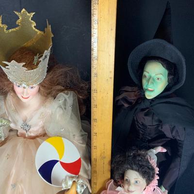 LOT 113: Collection of Wizard of Oz Franklin Heirloom Hand Painted Porcelain Dolls -Wicked Witch of the West, Glinda, Lollipop Boy and...