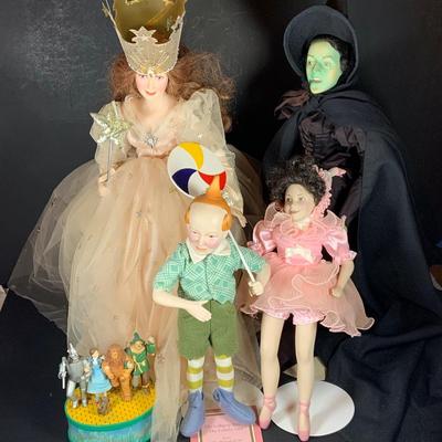 LOT 113: Collection of Wizard of Oz Franklin Heirloom Hand Painted Porcelain Dolls -Wicked Witch of the West, Glinda, Lollipop Boy and...