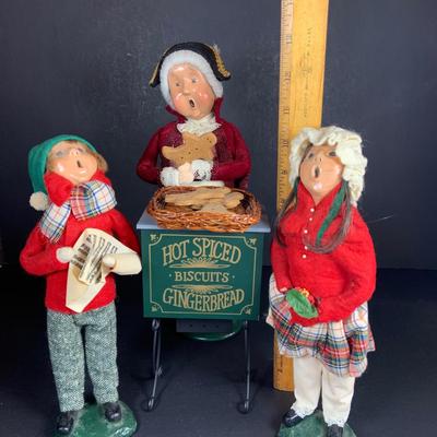 LOT 114: Set of 3 Byers' Choice Carolers - Two (2) Children From 1982 with Signed Bases and a Ginger Bread Seller and Stand from 1996