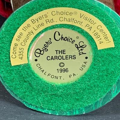 LOT 114: Set of 3 Byers' Choice Carolers - Two (2) Children From 1982 with Signed Bases and a Ginger Bread Seller and Stand from 1996