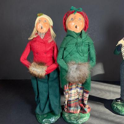 LOT 115: Collection of Four (4) Vintage Byers Choice Caroler Two (2) Women with Muff Hand Warmers and Two (2) Men with Sheet Music all...