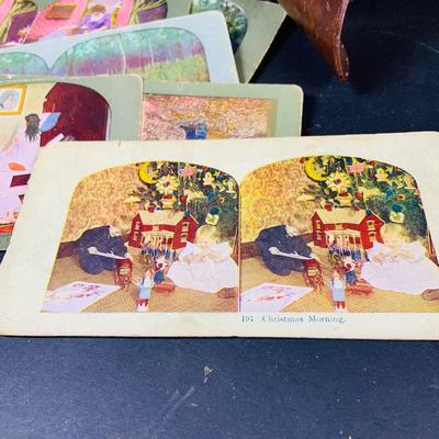 LOT 132: Antique Wood Stereoscope with Steroview Picture Cards of Victorian Christmas and More and Stereoview Scentic Pictures from...
