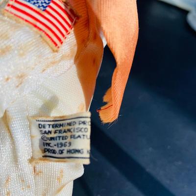 LOT 134: Vintage Peanuts Snoopy Astronaut from 1969 and 50th Anniversary Peanut Holiday Book and Snow Globe