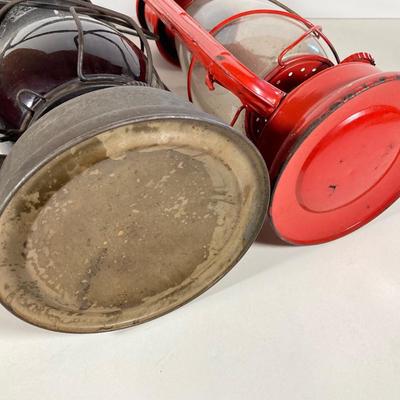 LOT 138: Three Oil Lanterns - Dietz (Gray) and Winged Wheel Brand (Red and Yellow)