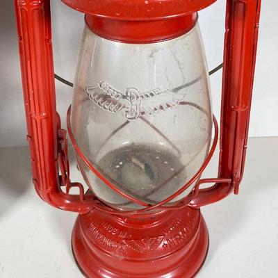 LOT 138: Three Oil Lanterns - Dietz (Gray) and Winged Wheel Brand (Red and Yellow)