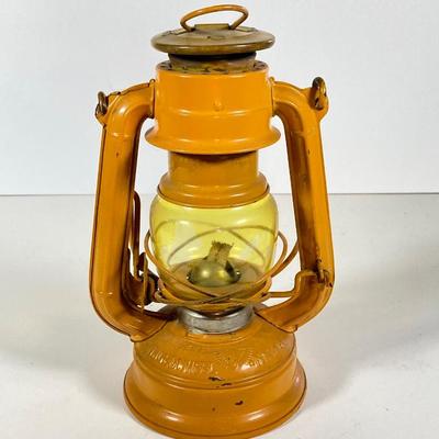 LOT 138: Three Oil Lanterns - Dietz (Gray) and Winged Wheel Brand (Red and Yellow)