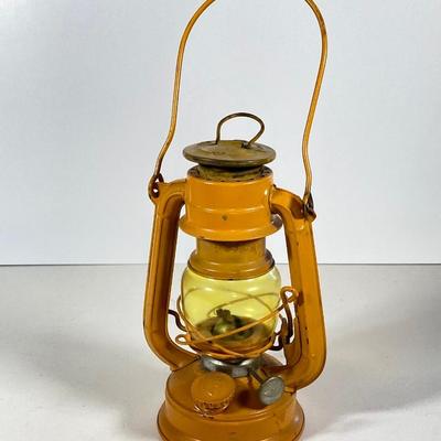 LOT 138: Three Oil Lanterns - Dietz (Gray) and Winged Wheel Brand (Red and Yellow)
