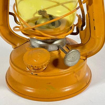 LOT 138: Three Oil Lanterns - Dietz (Gray) and Winged Wheel Brand (Red and Yellow)