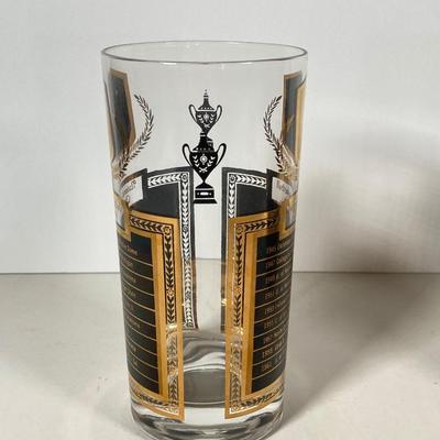 LOT 144: Seven MCM Sports Black and Gold Drinking Glasses / Barware