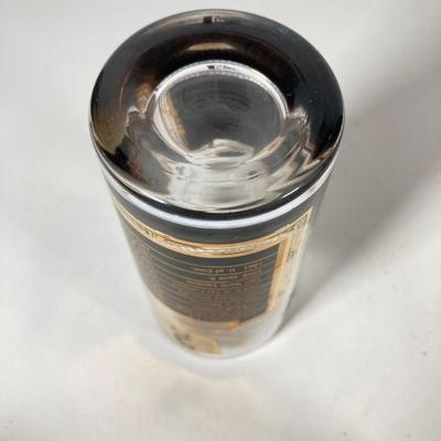 LOT 144: Seven MCM Sports Black and Gold Drinking Glasses / Barware