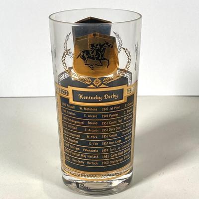 LOT 144: Seven MCM Sports Black and Gold Drinking Glasses / Barware