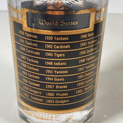 LOT 144: Seven MCM Sports Black and Gold Drinking Glasses / Barware