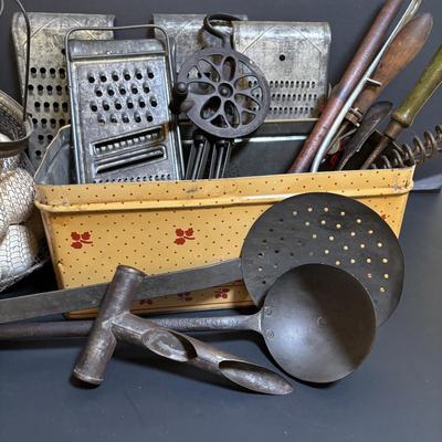 LOT 203: Antique Cast Iron Dover Egg Beater, Vintage Bread Tin, Graters, Utensils, Blown-out Eggs in Wire Basket