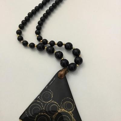 Vintage black beaded necklace with triangle, ceramic gold gilding pendant