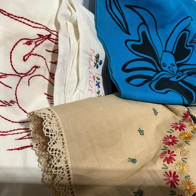 Embroidered pillow cases, dish towels, runners, bag